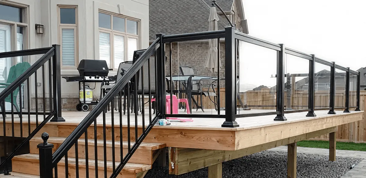 Handrail installation on a deck staircase for safety and code compliance in Tampa, FL